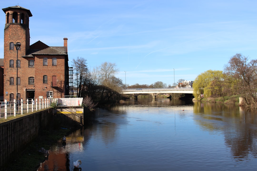 City Centre, Derby: brown concrete building near river during daytime